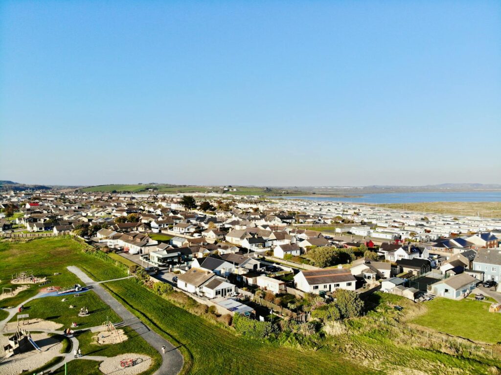 Scenic aerial view of Tramore, County Waterford, Ireland, showcasing residential area and coastline.