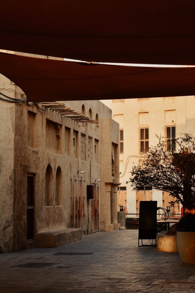 A serene view of a historic alley in Al Fahidi, Dubai, capturing traditional architecture at twilight.