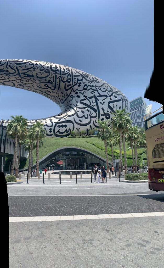 A double decker bus parked in front of a building